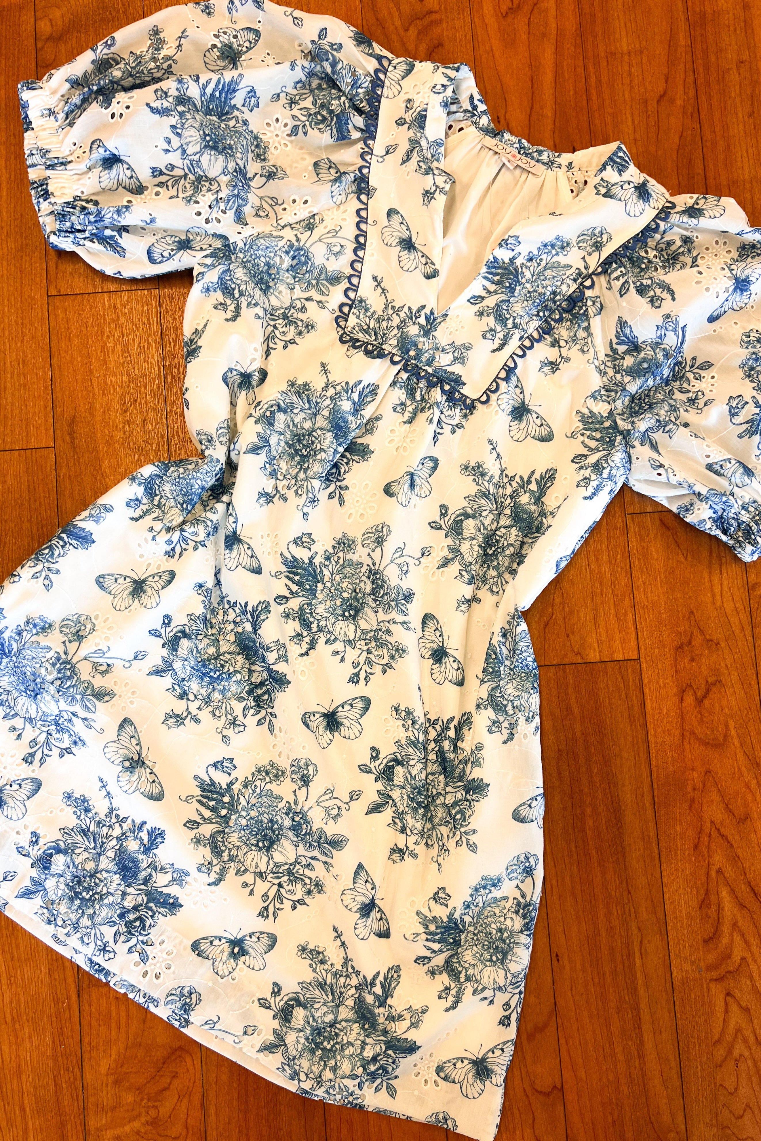 Floral patterned fabric on a wooden floor